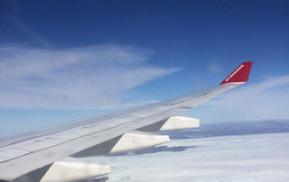 wing tip over Greenland